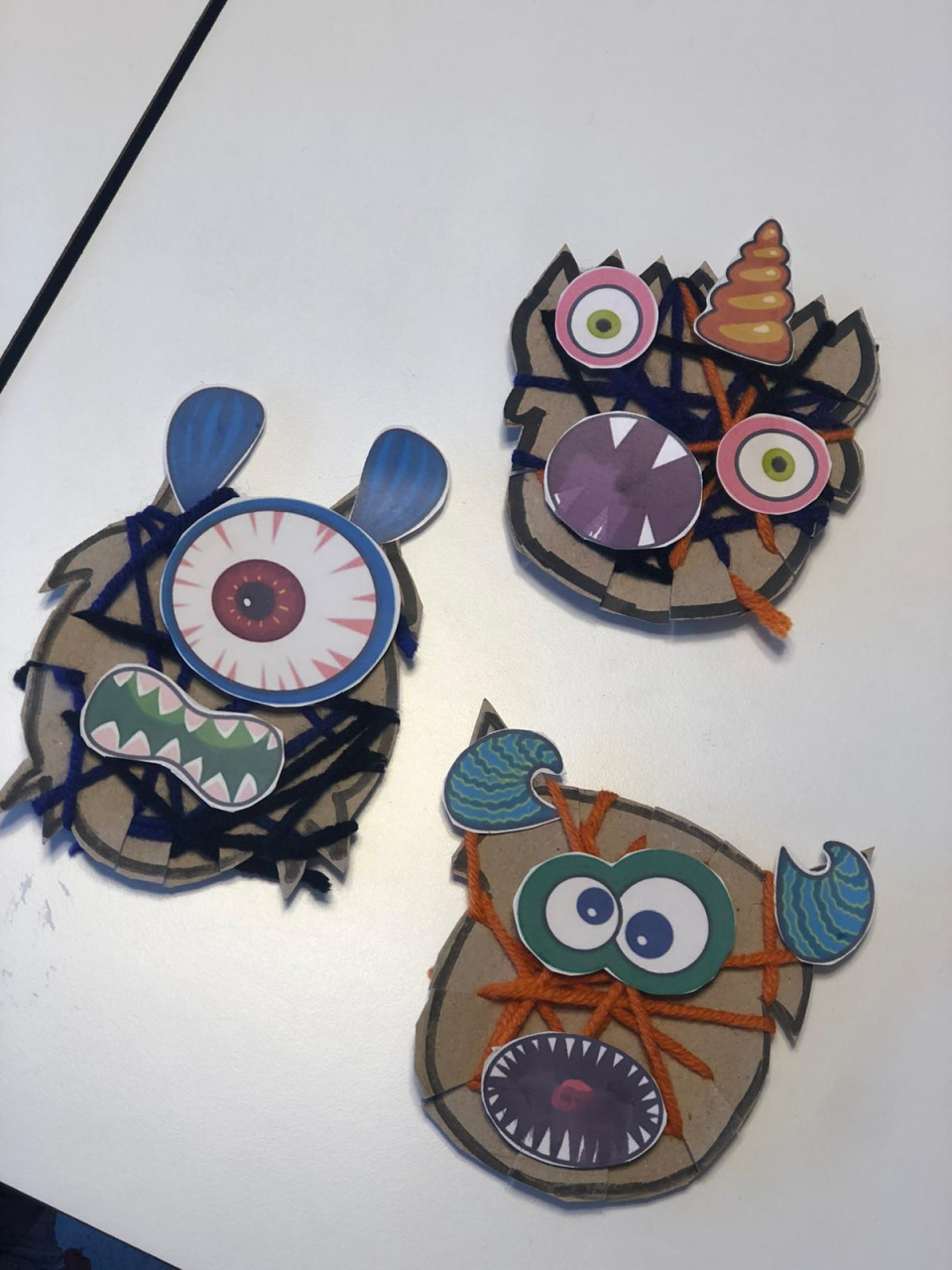 Wrapped with black, orange and purple yarn and created funny Monsters for Halloween