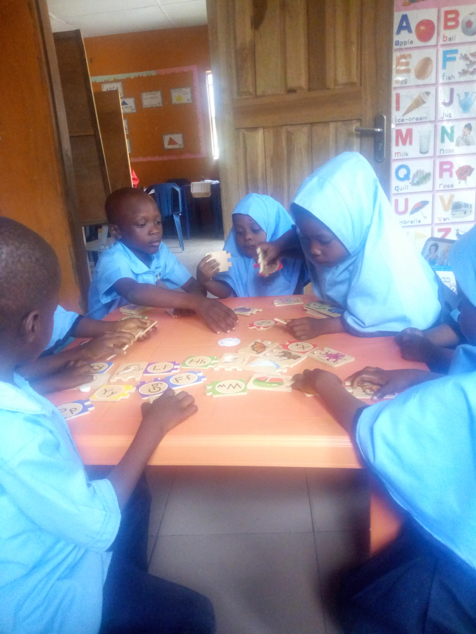 Children of Headstart Muslim Children's School working on puzzles